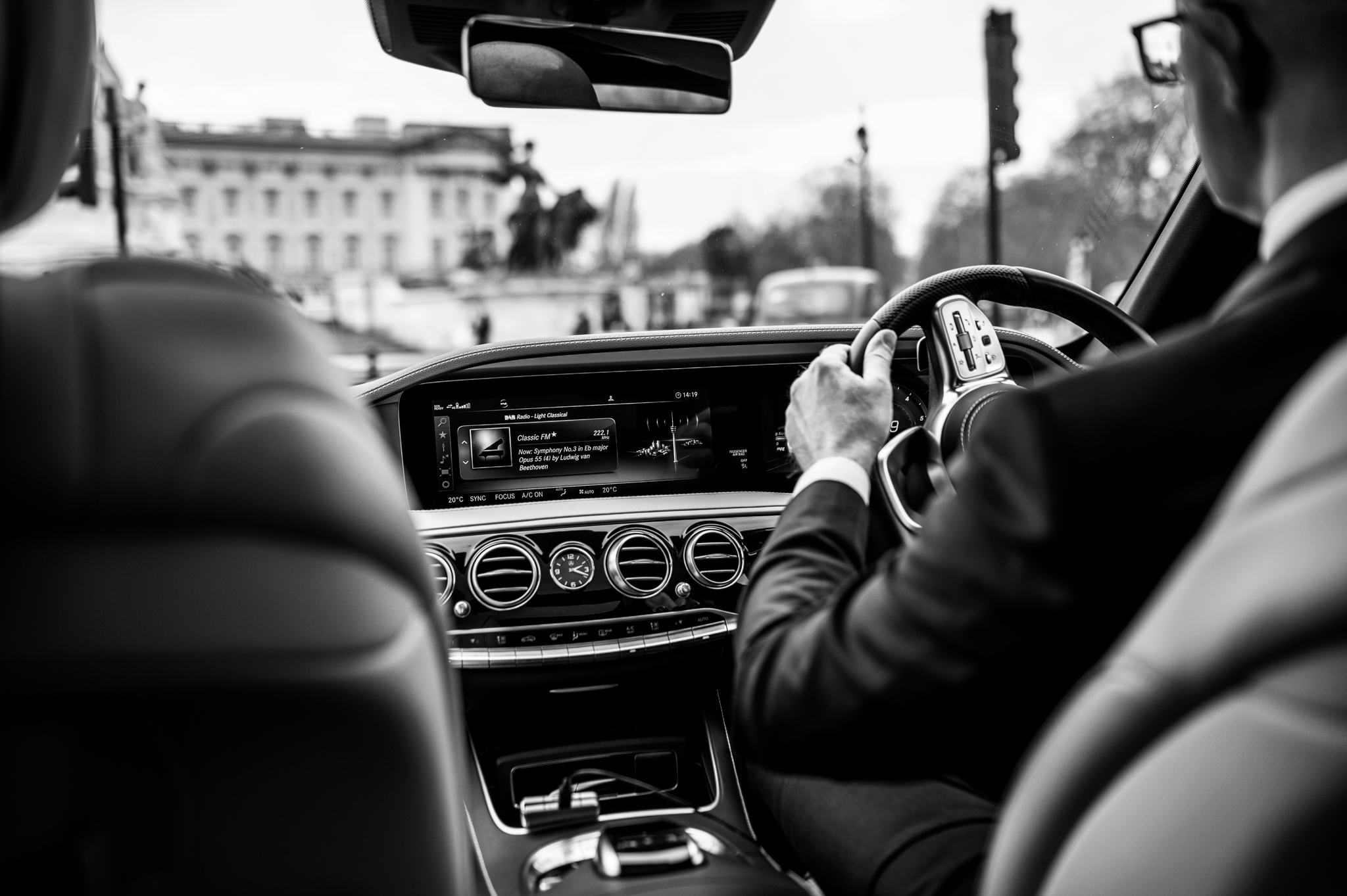 Inside a luxury OUNA car from the passenger's perspective